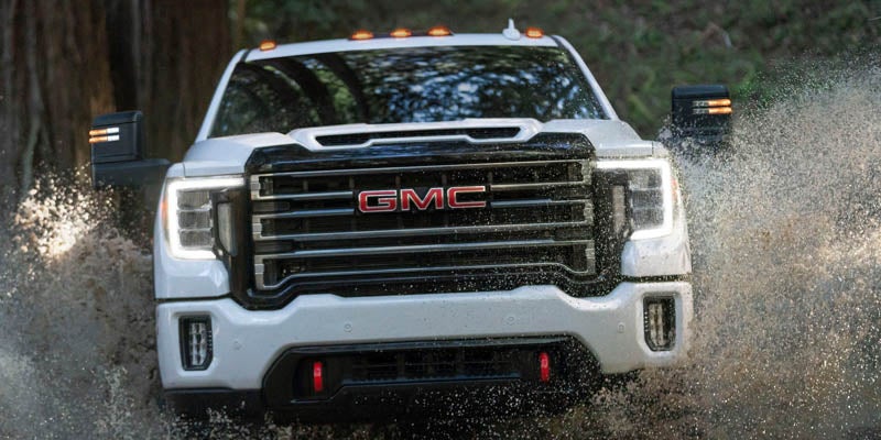 GMC Sierra 2500HD running through the river.