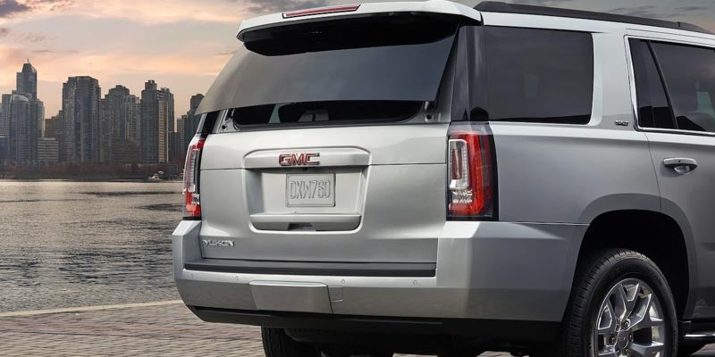 GMC Yukon rear side view river side